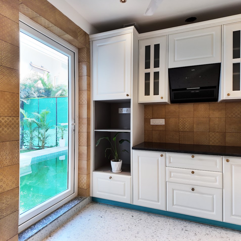 Florreta, Parra — white fitted kitchen with dark countertops and a window overlooking the private pool