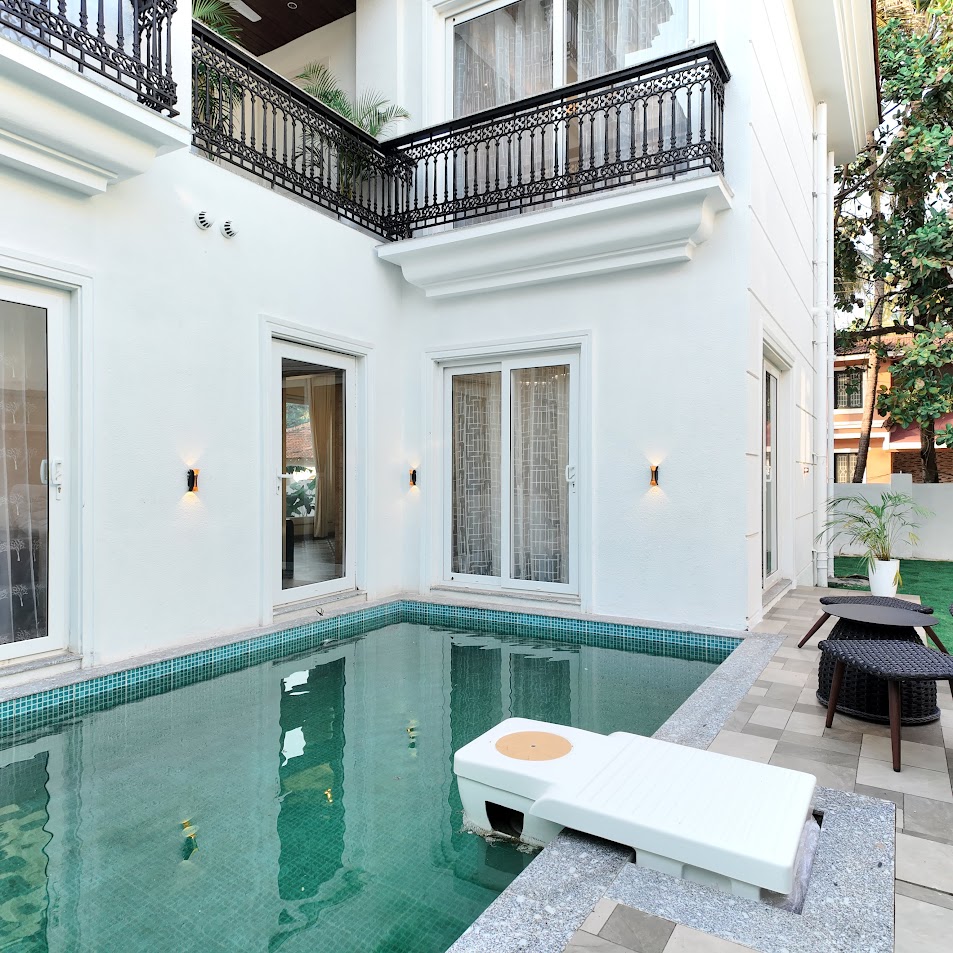 Florreta, Parra — private courtyard swimming pool with sun lounger, ornate balconies and warm wall lights